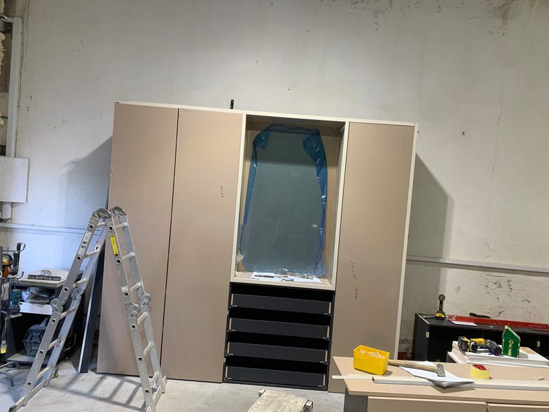 Closer view of the wardrobe, a ladder beside it