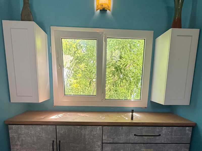 Drawers and wall cabinets around a window