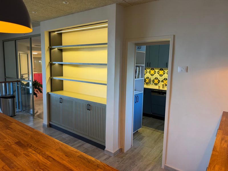 Lit shelving unit, side view
