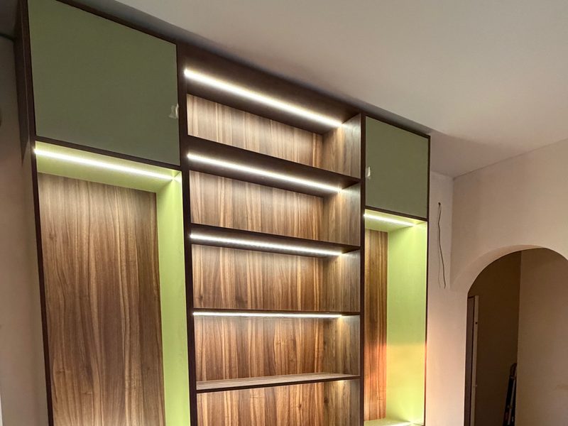 Lit wall unit with green doors