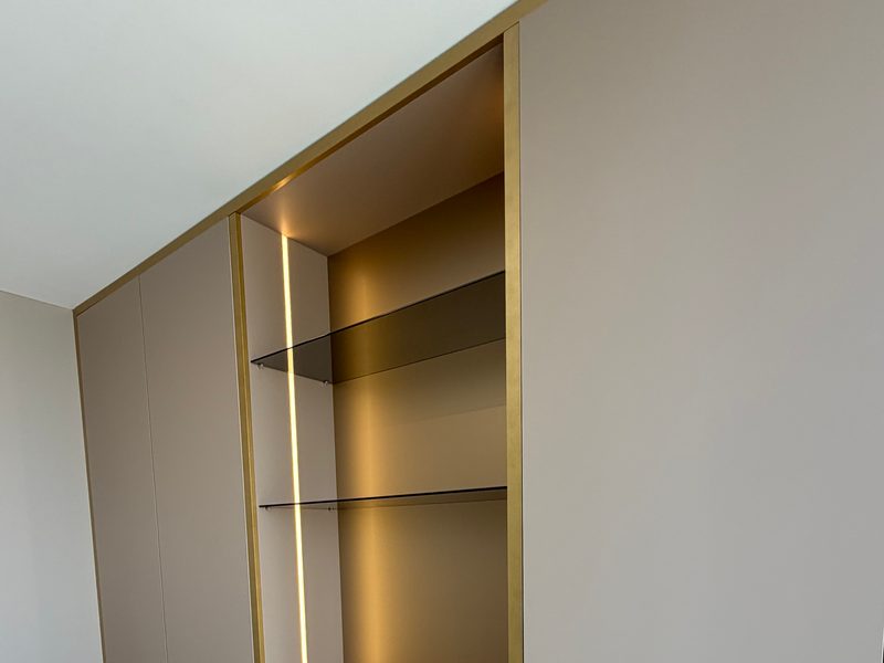Tall cabinet with lit display shelves