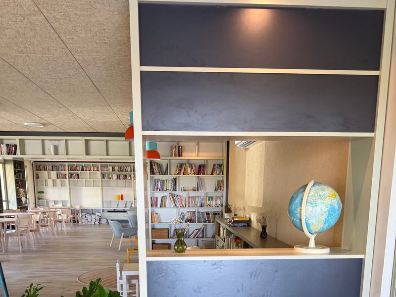 Two-sided shelving unit used as a room divider