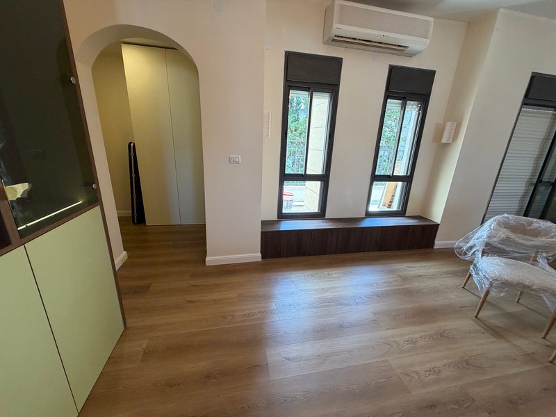 Window seat and green cabinets